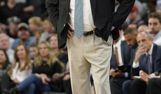 San Antonio Spurs coach Gregg Popovich reacts to a foul call during the first half of the team&#39;s NBA basketball game against the Washington Wizards, Wednesday, March 21, 2018, in San Antonio. (AP Photo/Darren Abate)