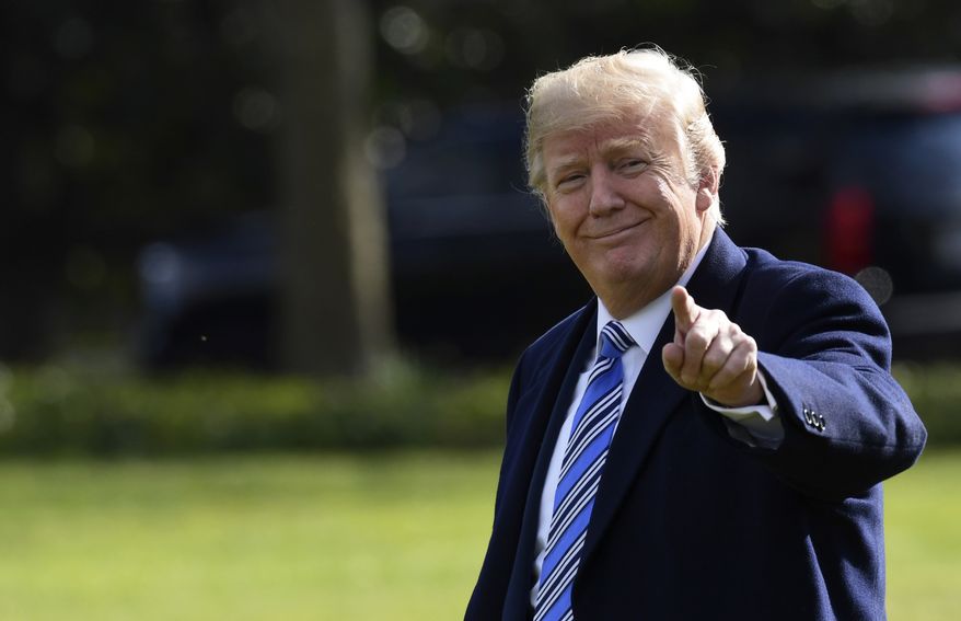 President Donald Trump walks across the South Lawn of the White House in Washington, Friday, March 23, 2018, as he heads to Marine One of a short trip to Andrews Air Force Base. Trump is heading to Florida where he will spend the weekend at the Mar-a-Lago estate. (AP Photo/Susan Walsh)