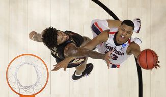 Gonzaga guard Zach Norvell Jr., right, shoots against Florida State forward Phil Cofer during the first half of an NCAA men&#39;s college basketball tournament regional semifinal Thursday, March 22, 2018, in Los Angeles. (AP Photo/Alex Gallardo)