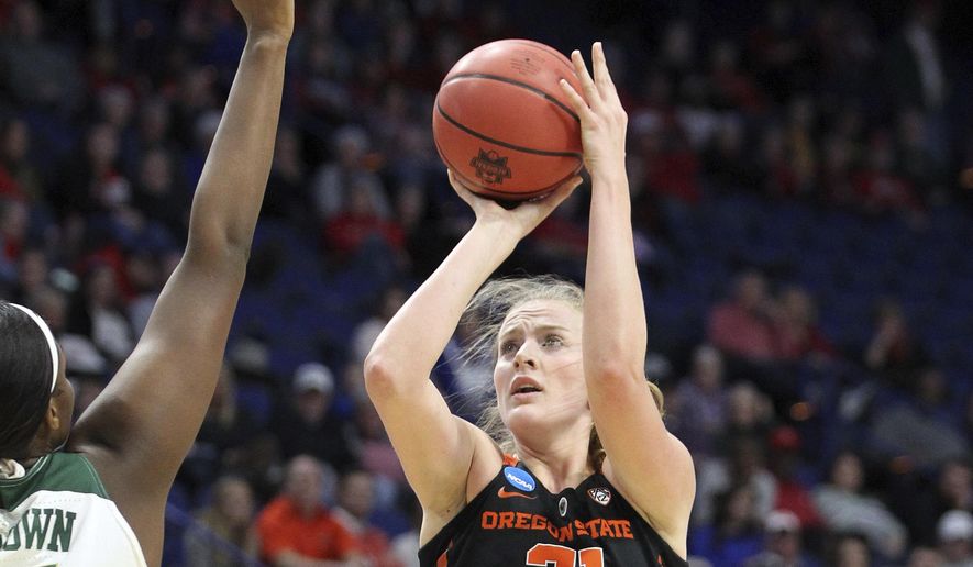 Oregon State&#x27;s Marie Gulich, right, shoots under pressure from Baylor&#x27;s Kalani Brown during the first half of an NCAA women&#x27;s college basketball tournament regional semifinal Friday, March 23, 2018, in Lexington, Ky. (AP Photo/James Crisp)