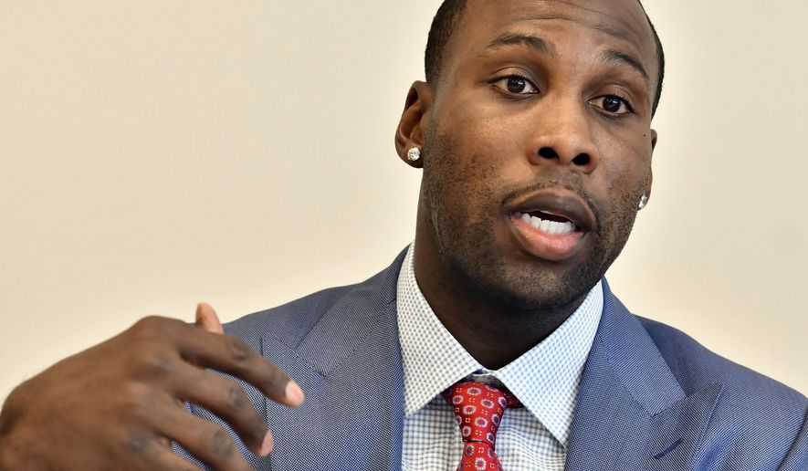 Former NFL player Anquan Boldin, speaks during a session to discuss criminal justice issues with other current and former NFL football players at Harvard Law School, Friday, March 23, 2018, in Cambridge, Mass. (AP Photo/Josh Reynolds)