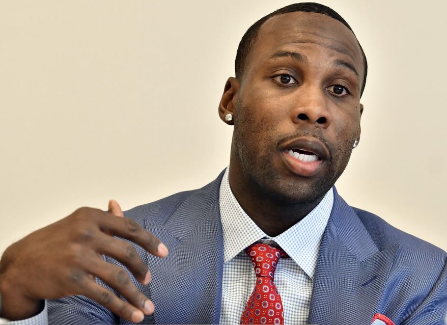 Former NFL player Anquan Boldin, speaks during a session to discuss criminal justice issues with other current and former NFL football players at Harvard Law School, Friday, March 23, 2018, in Cambridge, Mass. (AP Photo/Josh Reynolds)