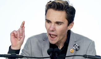David Hogg, a survivor of the mass shooting at Marjory Stoneman Douglas High School in Parkland, Fla., speaks during the &quot;March for Our Lives&quot; rally in support of gun control in Washington, Saturday, March 24, 2018. (AP Photo/Andrew Harnik) ** FILE **