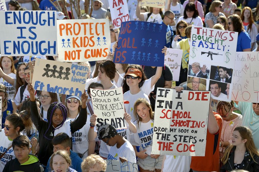 March For Our Lives Fort Worth event on the court house steps in Fort Worth, Texas, Saturday, March 24, 2018. Large rallies with crowds estimated in the tens of thousands in some cases also unfolded in such cities as Boston; New York; Los Angeles; Chicago; Houston; Phoenix; Fort Worth, Texas; Minneapolis; and Parkland, Florida, the site of the Feb. 14 attack at Marjory Stoneman Douglas High School that left 17 people dead. Protesters denounced the National Rifle Association and its allies and complained that they are scared of getting shot in school and tired of inaction by grown-ups after one mass shooting after another. (Max Faulkner /Star-Telegram via AP)