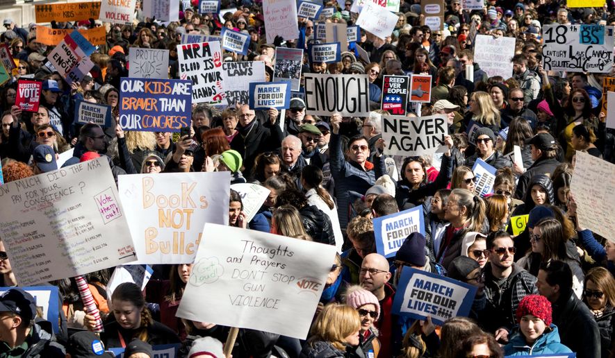 People take part in a march rally against gun violence Saturday, March 24, 2018, in New York. Tens of thousands of people poured into the nation&#x27;s capital and cities across America on Saturday to march for gun control and ignite political activism among the young.  (AP Photo/Craig Ruttle)