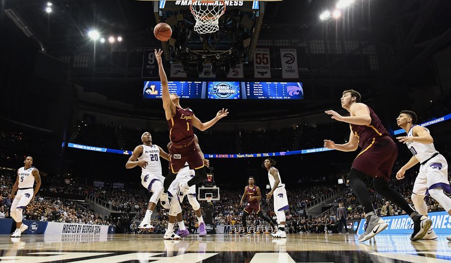 Loyola-Chicago guard Lucas Williamson (1) shoots against Kansas State forward Xavier Sneed (20) during the first half of a regional final NCAA college basketball tournament game, Saturday, March 24, 2018, in Atlanta. (AP Photo/John Amis)