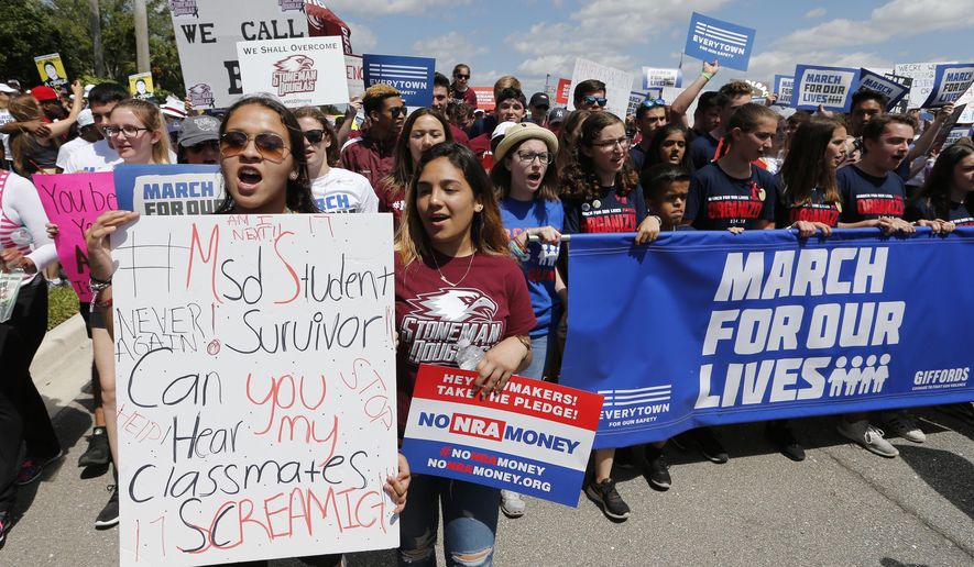 Marjory Stoneman Douglas High School students led a &amp;quot;March For Our Lives&amp;quot; rally Saturday, March 24, 2018, in Parkland, Fla. Thousands of people filled a park near Marjory Stoneman Douglas High School for a rally near the site of last month&#x27;s school massacre in Parkland. After the rally participants marched to Stoneman Douglas. (AP Photo/Joe Skipper)