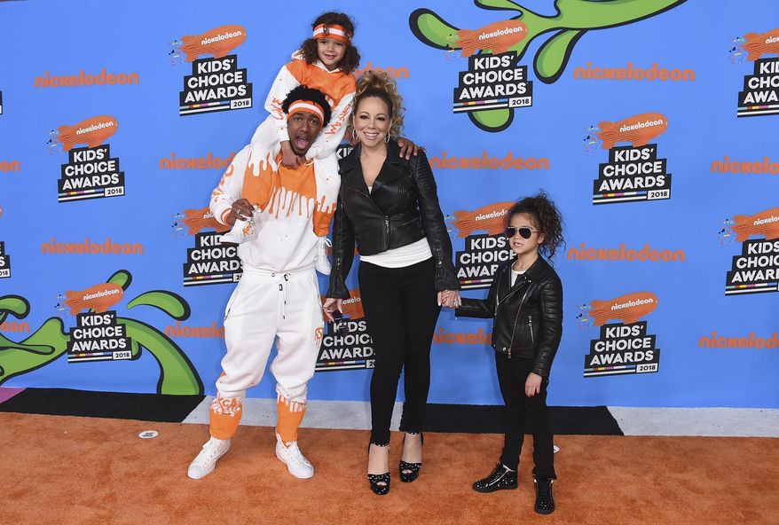 Nick Cannon, center left, Mariah Carey, center right, and from left, their children Moroccan and Monroe arrive at the Kids' Choice Awards at The Forum on Saturday, March 24, 2018, in Inglewood, Calif. (Photo by Jordan Strauss/Invision/AP)