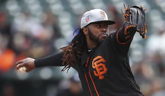 San Francisco Giants&#39; Johnny Cueto works against the Oakland Athletics during the first inning of a spring training baseball game on Sunday, March 25, 2018 in Oakland, Calif. (AP Photo/Ben Margot)