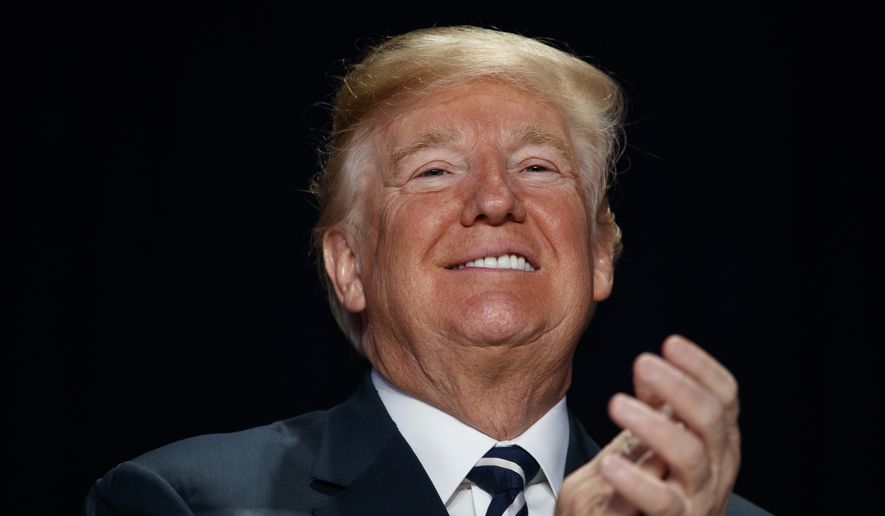 President Donald Trump smiles during the National Prayer Breakfast, Thursday, Feb. 8, 2018, in Washington. (AP Photo/Evan Vucci) ** FILE **