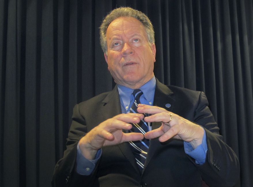 David Beasley, executive director of the World Food Program, talks during an interview at the Department of Foreign Affairs and Trade in Canberra, Australia, Monday, March 26, 2018. Beasley says the collapse of the Islamic State movements self-described caliphate across Syria and Iraq has led to extremists mounting a recruitment drive in sub-Sahara Africa which threatens to trigger a new European migrant crisis. (AP Photo/Rod McGuirk)