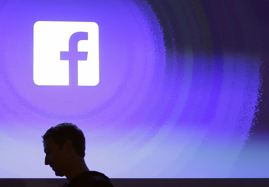 In this April 4, 2013, file photo, Facebook CEO Mark Zuckerberg walks at the company's headquarters in Menlo Park, Calif. (AP Photo/Marcio Jose Sanchez, File)