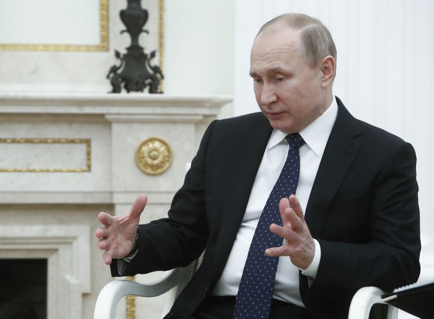 Russian President Vladimir Putin gestures as he speaks to Qatar Sheikh Tamim bin Hamad al-Thani during their meeting in the Kremlin in Moscow, Russia, Monday, March 26, 2018. (Sergei Karpukhin/Pool Photo via AP) ** FILE **