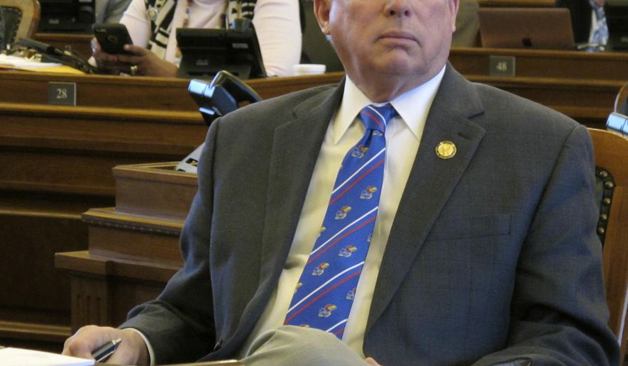 Kansas House Majority Leader Don Hineman, R-Dighton, watches one of the House's electronic tally boards as members approve a bill to narrow a law prohibiting state contractors from boycotting Israel, Monday, March 26, 2018, at the Statehouse in Topeka, Kan. The bill is designed to salvage the law after a federal judge blocked its enforcement (AP Photo/John Hanna)