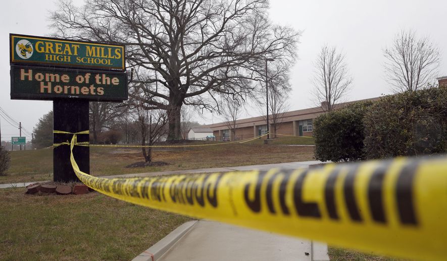 FILE - This Tuesday, March 20, 2018, file photo, shows crime scene tape around Great Mills High School, the scene of a shooting in Great Mills, Md. In a statement released Monday, March 26, 2018, authorities said the student who fatally shot a female classmate at the school died from a self-inflicted gunshot wound. (AP Photo/Alex Brandon, File)