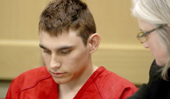 In this Feb. 19, 2018, file photo, Nikolas Cruz, accused of murdering 17 people in the Florida high school shooting, appears in court for a status hearing in Fort Lauderdale, Fla. Cruz was formally charged Wednesday, March 7, with 17 counts of first-degree murder, which could mean a death sentence if he is convicted. (Mike Stocker/South Florida Sun-Sentinel via AP, Pool, File)