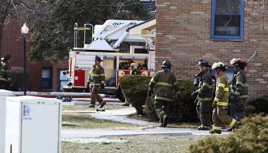 In this Sunday, March 25, 2018 photo, Gary fire and police crews respond to the scene of a deadly fire at the Lakeshore Dunes Apartments in Gary, Ind. The cause is under investigation. (Kale Wilk/The Times via AP)