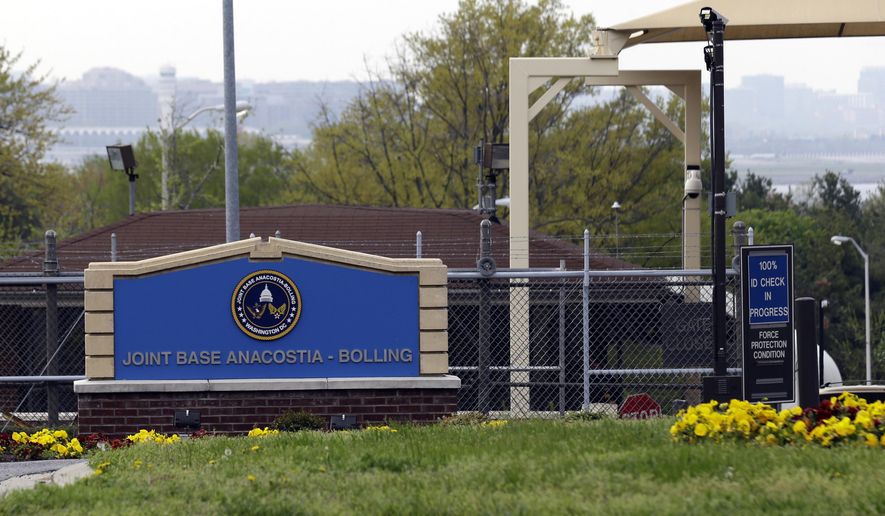 This April 17, 2013, file photo shows the gate for the Joint Base Anacostia-Bolling in Washington. The Defense Department says they are tracking the delivery of suspicious packages to multiple military installations in the Washington, region. (AP Photo/Alex Brandon, File)