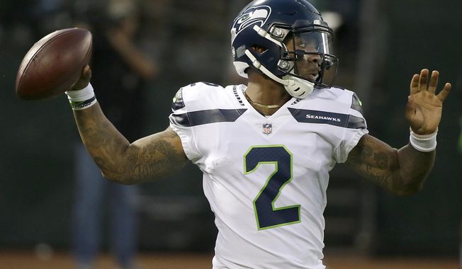 FILE - In this Aug. 31, 2017, file photo, Seattle Seahawks quarterback Trevone Boykin (2) passes against the Oakland Raiders during the first half of an NFL preseason football game in Oakland, Calif. The Seattle Seahawks released quarterback Trevone Boykin shortly after his girlfriend alleged in a television interview that he physically assaulted her in Texas. The practice squad player was released from the team Tuesday, March 27, 2018, after WFAA-TV in Dallas posted an interview with Boykin's girlfriend. She alleges he broke her jaw during an altercation last week in Mansfield, southwest of Dallas. Boykin's agent, Drew Pittman, told the station the allegations are false. Mansfield police told WFAA that Boykin is under investigation. (AP Photo/Eric Risberg, File)