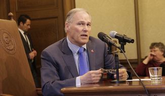 Gov. Jay Inslee speaks to reporters after signing a bill that alters the contracting structure of home health care workers, on Tuesday, March 27, 2018, in Olympia, Wash. Supporters of the measure says it streamlines management services of health care workers, but opponents who had asked Inslee to veto it argued it was meant to let a powerful union skirt a court ruling that pertained to union membership. (AP Photo/Rachel La Corte)