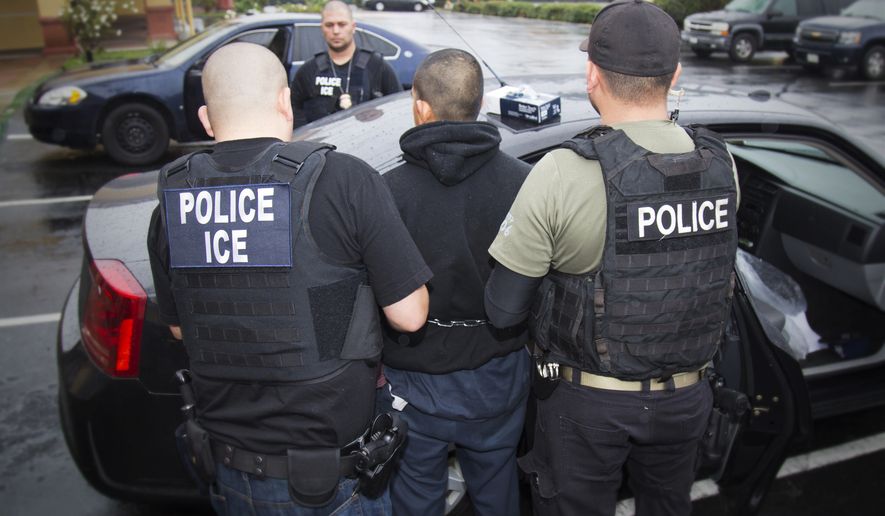 FILE - In this Feb. 7, 2017, photo released by U.S. Immigration and Customs Enforcement, foreign nationals are arrested during a targeted enforcement operation conducted by U.S. Immigration and Customs Enforcement (ICE) aimed at immigration fugitives, re-entrants and at-large criminal aliens in Los Angeles. Federal immigration agents arrested 115 people during a three-day operation in the San Diego area amid heightened tensions between the Trump administration and the state of California over immigration enforcement. (Charles Reed/U.S. Immigration and Customs Enforcement via AP, File)