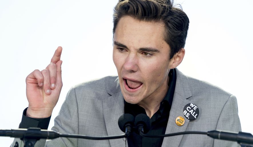 David Hogg, a survivor of the mass shooting at Marjory Stoneman Douglas High School in Parkland, Fla., speaks during the &quot;March for Our Lives&quot; rally in support of gun control in Washington, Saturday, March 24, 2018. (AP Photo/Andrew Harnik)