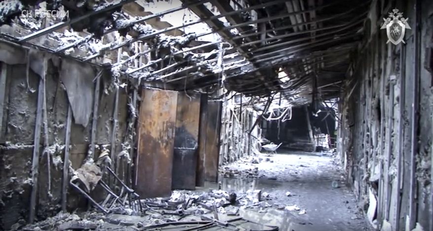 This The Investigative Committee of the Russian Federation frame grab, distributed on Tuesday, March 27, 2018, shows consequences of a fire inside the multistory shopping center after a fire, in the Siberian city of Kemerovo, about 3,000 kilometers (1,900 miles) east of Moscow, Russia. Investigators identified a short circuit as a possible cause and said the emergency exits were locked shut, hampering an evacuation. Some of the victims, many of them young children, died inside a locked movie theater. (The Investigative Committee of the Russian Federation via AP)