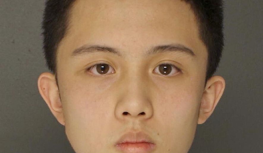 This undated photo provided by the Upper Darby Police Department in Upper Darby, Pa., shows An Tso Sun, a Taiwanese exchange student charged with making terroristic threats after he was arrested for threatening a shooting at his high school, Monsignor Bonner and Archbishop Prendergast Catholic High School in Drexel Hill, Pa. Police said Wednesday, March 28, 2018, that Sun had researched how to buy weapons, and that a military-style ballistic vest, ammunition clip pouches, a high-powered crossbow and live ammunition were found in his bedroom in Lansdowne, Pa. Sun is in custody in Delaware County Prison in Thornton, Pa., in lieu of $100,000 bail. (Upper Darby Police Department via AP)