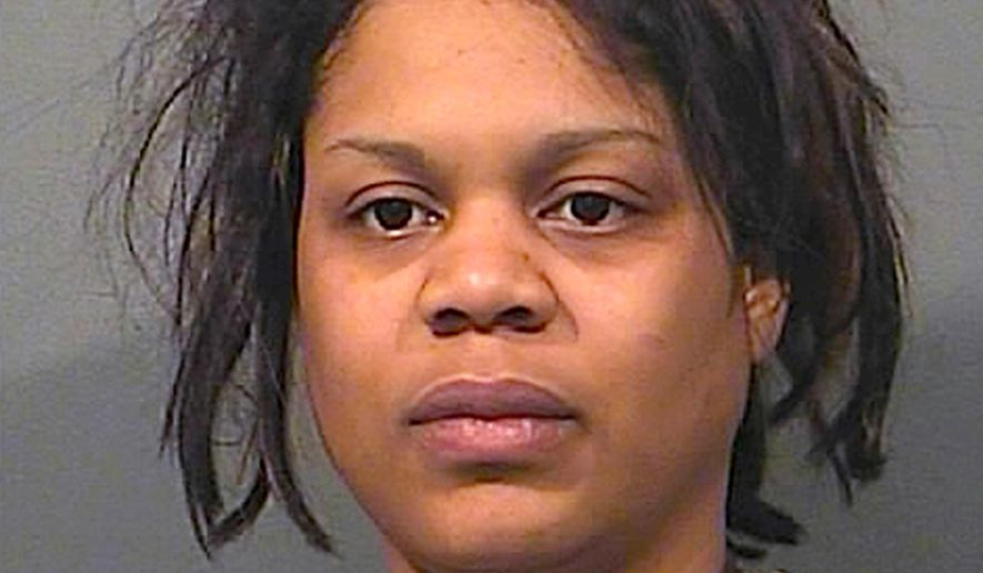 This undated photo provided by the Gary Police Department shows Kristen Gober. Gary, Ind., police say Gober was charged Tuesday, March 27, 2018 with two counts of child neglect causing death and other charges. Gober, the mother of two young children who were killed in a northwestern Indiana apartment building fire, has been charged with leaving them alone for several hours before the youngsters started the blaze while playing with the kitchen stove. (Gary Police Department via AP)