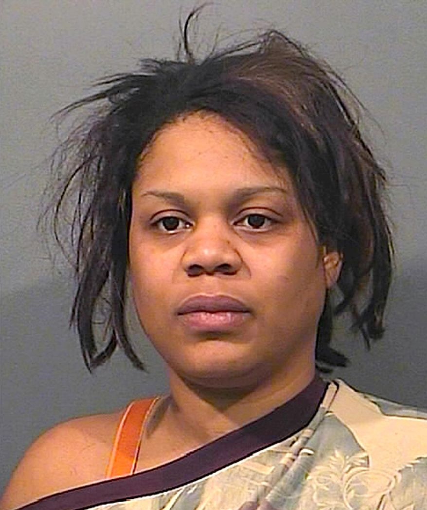 This undated photo provided by the Gary Police Department shows Kristen Gober. Gary, Ind., police say Gober was charged Tuesday, March 27, 2018 with two counts of child neglect causing death and other charges. Gober, the mother of two young children who were killed in a northwestern Indiana apartment building fire, has been charged with leaving them alone for several hours before the youngsters started the blaze while playing with the kitchen stove. (Gary Police Department via AP)