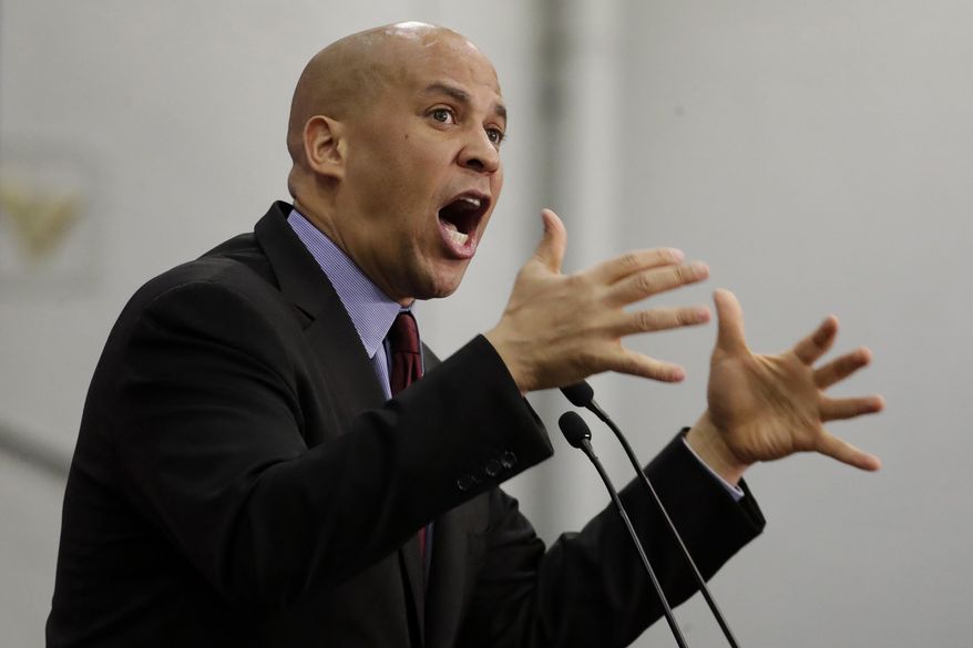 U.S. Sen. Cory Booker speaks during an event kicking off U.S. Sen. Bob Menendez&#39;s campaign for re-election at Union City High School, Wednesday, March 28, 2018, in Union City, N.J. (AP Photo/Julio Cortez) ** FILE **