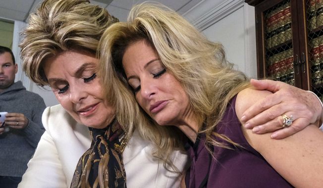 Attorney Gloria Allred, left, comforts Summer Zervos during a news conference in Los Angeles, Friday Oct. 14, 2016. Zervos, a former contestant on &quot;The Apprentice&quot; says Republican presidential candidate Donald Trump made unwanted sexual contact with her at a Beverly Hills hotel in 2007. Zervos is among several women who have made sexual allegations against the Republican nominee. He has strenuously denied them. (AP Photo/Ringo H.W. Chiu)