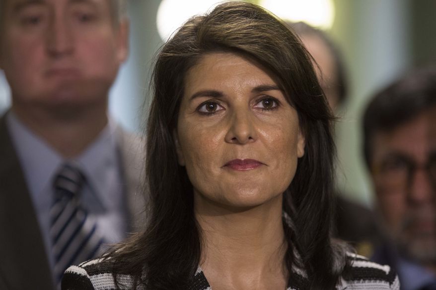 Nikki Haley, U.S. ambassador to the U.N., left, stands with Guatemala's President Jimmy Morales as they give statements after their meeting at the National Palace of Culture in Guatemala City, Wednesday, Feb. 28, 2018. (AP Photo/Luis Soto)