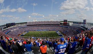 FILE - In this Sept. 10, 2017, file photo, fans stand for the playing of the National Anthem at New Era Stadium before an NFL football game between the Buffalo Bills and the New York Jets, in Orchard Park, N.Y. The Buffalo Bills&#39; long-term future in Western New York was secured when Terry and Kim Pegula purchased the franchise following the death of Hall of Fame owner Ralph Wilson in October 2014. Where the team will play its home games _ at its current stadium in suburban Orchard Park, or at a new downtown Buffalo facility _ within the next decade is the question now inching to the forefront.(AP Photo/Frank Franklin II, File)