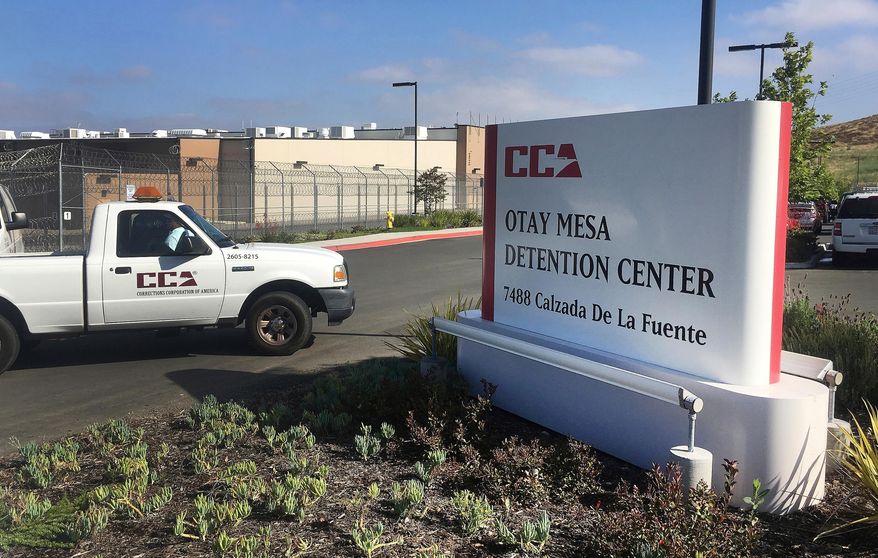 A vehicle drives into the Otay Mesa detention center in San Diego, Calif. (AP Photo/Elliot Spagat, File)