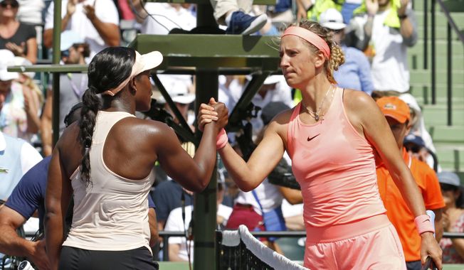 Sloane Stephens, left, shakes hands with Victoria Azarenka, of Belarus, after Stephens&#x27; 3-6, 6-2, 6-1 win in their semifinal match in the Miami Open tennis tournament, Thursday, March 29, 2018, in Key Biscayne, Fla. (AP Photo/Joe Skipper)  **FILE**