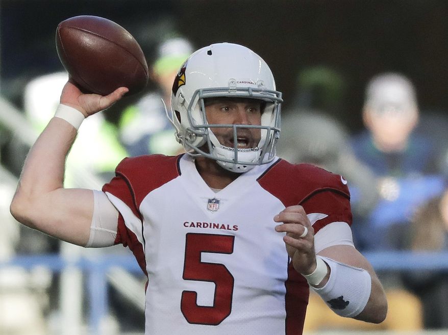 This Dec. 31, 2017 photo shows Arizona Cardinals quarterback Drew Stanton passes against the Seattle Seahawks in the first half of an NFL football game in Seattle. The Cleveland Browns have agreed to a two-year contact with free agent quarterback Drew Stanton. The team announced the pact on Sunday, March 25, 2018. (AP Photo/Elaine Thompson)