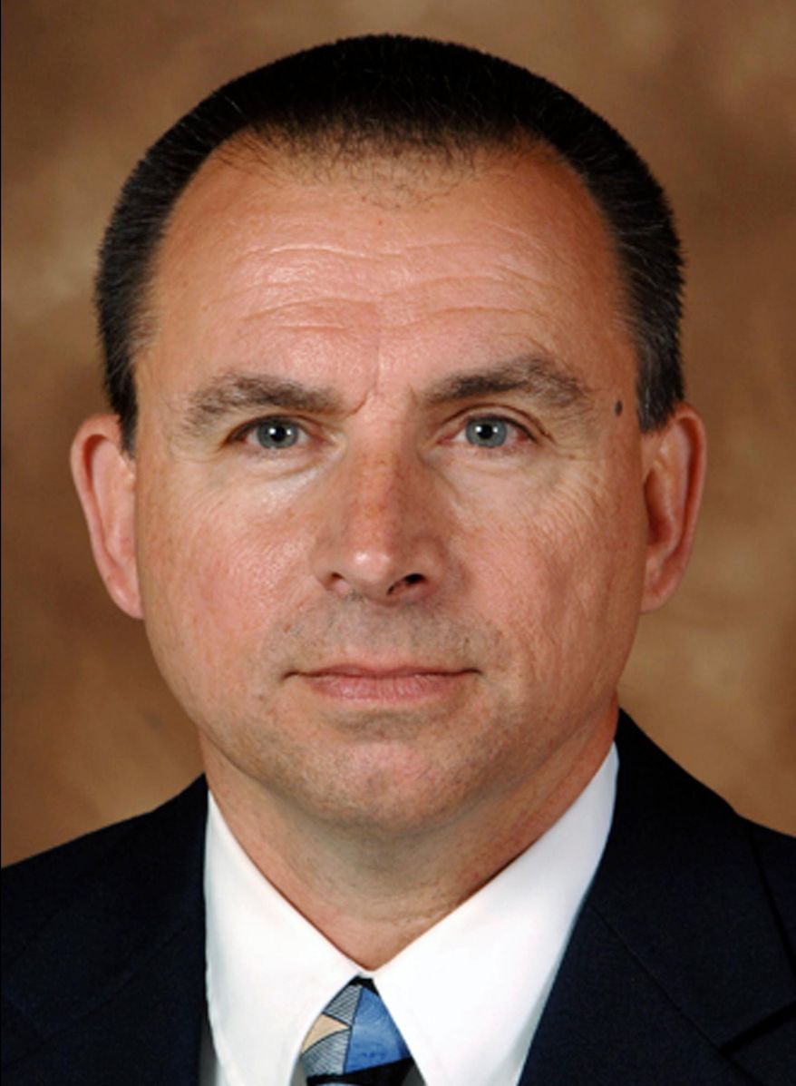 FILE - This undated file photo provided by the Iowa Department of Public Safety shows former Division of Criminal Investigation agent Larry Hedlund. A judge has dismissed a lawsuit brought by a fired Iowa investigator who complained he was punished for reporting speeding by Gov. Terry Branstad's security detail. Judge David May on Friday, March 30, 2018, dismissed several claims brought by former Division of Criminal Investigation agent Hedlund. (Iowa Department of Public Safety via AP, File)