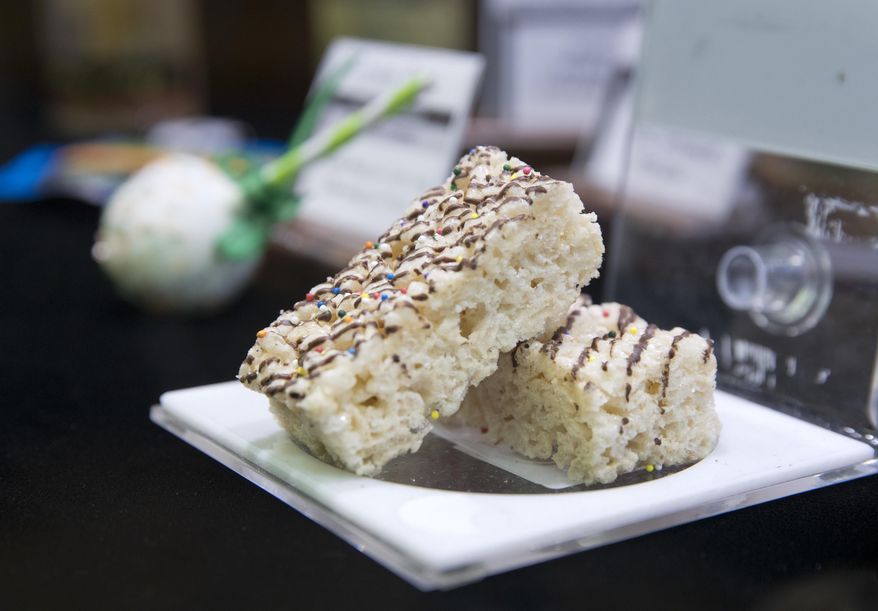 In this Jan. 4, 2018 photo, marijuana edibles are displayed at the Apothecary Shoppe marijuana dispensary in Las Vegas. Marijuana edibles have quickly become a hot seller in the first seven months of legalized pot in Nevada, with as much as 45 percent of all weed sales being edibles, according to figures from several dispensary owners. (Steve Marcus/Las Vegas Sun via AP)