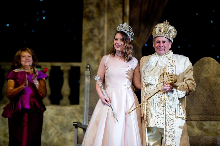 In this Saturday, Oct. 15, 2016 photo, Aksarben Queen Elizabeth Kaitlyn Fitzgerald, left, and King Ken Bird smile during the Aksarben Coronation & Scholarship Ball in Omaha, Neb. (Sarah Hoffman/Omaha World-Herald via AP)