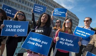 In this Friday, Oct. 20, 2017, file photo, activists with Planned Parenthood demonstrate in support of a pregnant 17-year-old being held in a Texas facility for unaccompanied immigrant children to obtain an abortion, outside of the Department of Health and Human Services in Washington. A federal court in Washington told the Trump administration Friday, March 30, 2018, that the government can&#x27;t interfere with the ability of pregnant immigrant teens being held in federal custody to obtain abortions. (AP Photo/J. Scott Applewhite) **FILE**