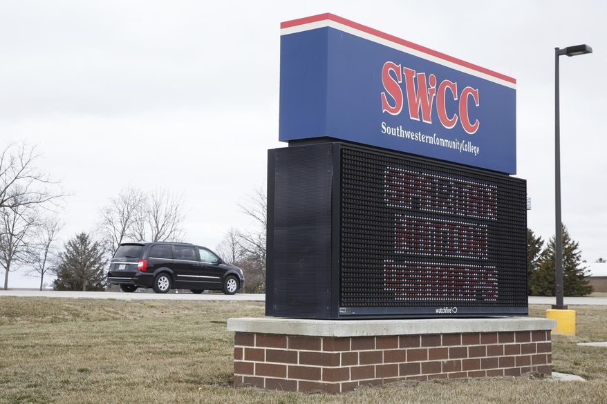 Cars enter Southwester Community College for memorial services for Kevin Sharp, his wife, Amy Sharp, and their children, Sterling and Adrianna on Saturday, March 31, 2018, in Creston, Iowa. The family were found dead while on vacation in Mexico. A Mexican prosecutor says a gas leak in a water heater is suspected of killing them inside their rented condominium in Tulum. Their bodies were found Friday. (Brian Powers/The Des Moines Register via AP)