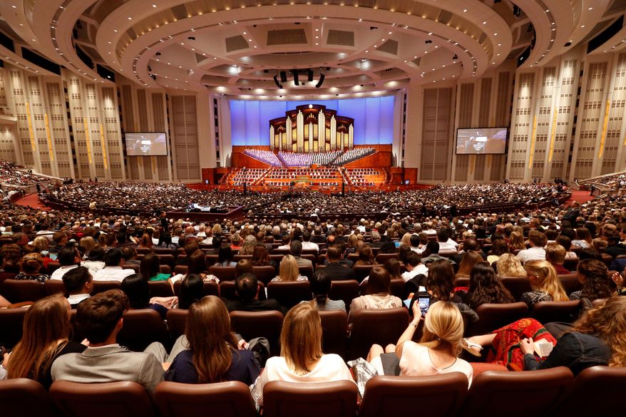 FILE - In this Sept. 30, 2017, file photo, people attend the morning session of the two-day Mormon church conference in Salt Lake City. A Mormon church conference that kicks off Saturday, March 31, 2018, in Utah will usher in a new era of leadership as the religion's new president presides over the proceedings for the first time and the faith chooses two new men to fill openings on a top governing body. (AP Photo/Rick Bowmer, File)