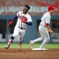 Atlanta Braves&#39; Ozhaino Albies rounds second for a triple in the first inning of a baseball game against the Philadelphia Phillies, Saturday, March 31, 2018, in Atlanta. (AP Photo/Todd Kirkland)