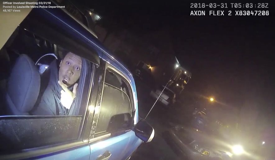 In this screen grab from body camera video provided by the Louisville Metro Police Department, Elijah Eubanks talks to a police officer from the passenger side of a car, early Saturday, March 31, 2018, in Louisville, Ky. Moments later, Eubanks was shot and wounded after police say he fired a revolver at the officer. (Louisville Metro Police Department via AP)