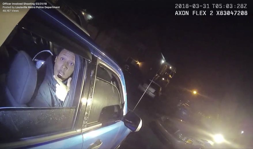 In this screen grab from body camera video provided by the Louisville Metro Police Department, Elijah Eubanks talks to a police officer from the passenger side of a car, early Saturday, March 31, 2018, in Louisville, Ky. Moments later, Eubanks was shot and wounded after police say he fired a revolver at the officer. (Louisville Metro Police Department via AP)