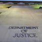 In this May 14, 2013, file photo, the Department of Justice headquarters building in Washington is photographed early in the morning. (AP Photo/J. David Ake, File)  **FILE**