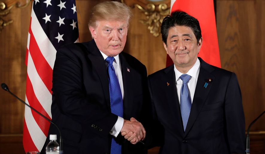 President Donald Trump, left, shakes hands with Japanese Prime Minister Shinzo Abe during a joint news conference at the Akasaka Palace, in Tokyo. Prime Minister Abe has announced plans to visit the U.S. from April 17-20, 2018, to discuss North Korea with President Trump ahead of expected summits between the North and the U.S. and South Korea. (Kiyoshi Ota/Pool Photo via AP, File)