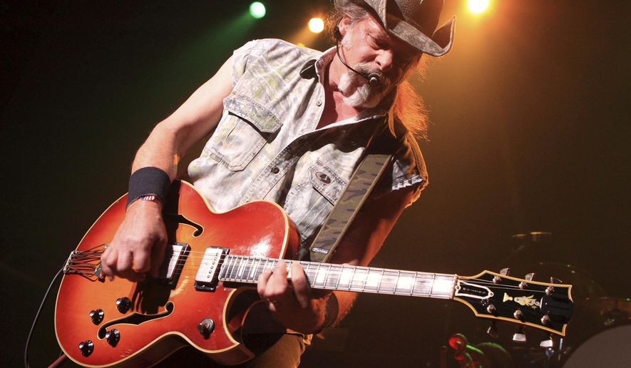In this Aug. 16, 2013 file photo shows Ted Nugent performs at Rams Head Live in Baltimore. (Photo by Owen Sweeney/Invision/AP, File)
