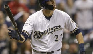Milwaukee Brewers&#39; Christian Yelich watches his game tying solo home run off of St. Louis Cardinals&#39; Dominic Leon during the ninth inning of a baseball game Tuesday, April 3, 2018, in Milwaukee. (AP Photo/Tom Lynn)